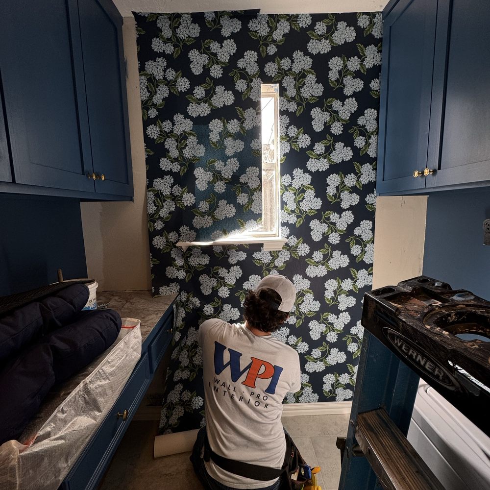 Wallpapered hallway with detailed wallcovering